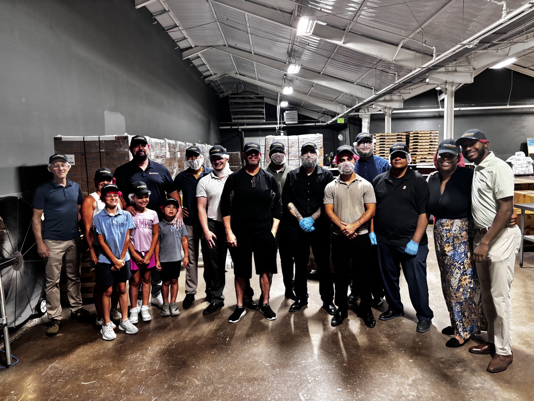 Rohrman Automotive Group teammates packing meals by hand